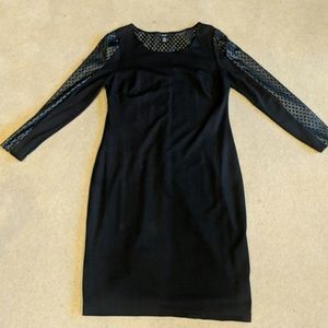 Black dress with perforated leather detailing